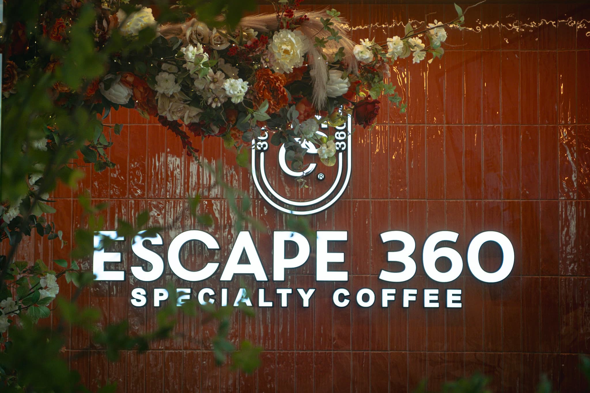 The Escape 360 Specialty Coffee brand wall