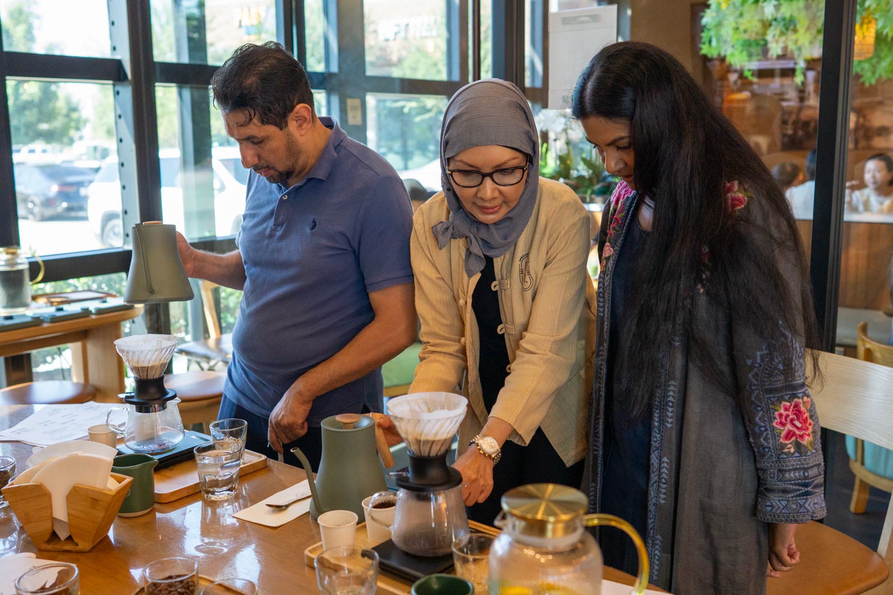 Chef Rosie guiding guests through a pour-over at Escape 360 Carrollton